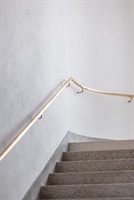 Detail of the town hall staircase with a wooden handrail
