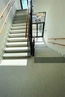 School terrazzo staircase with a railing